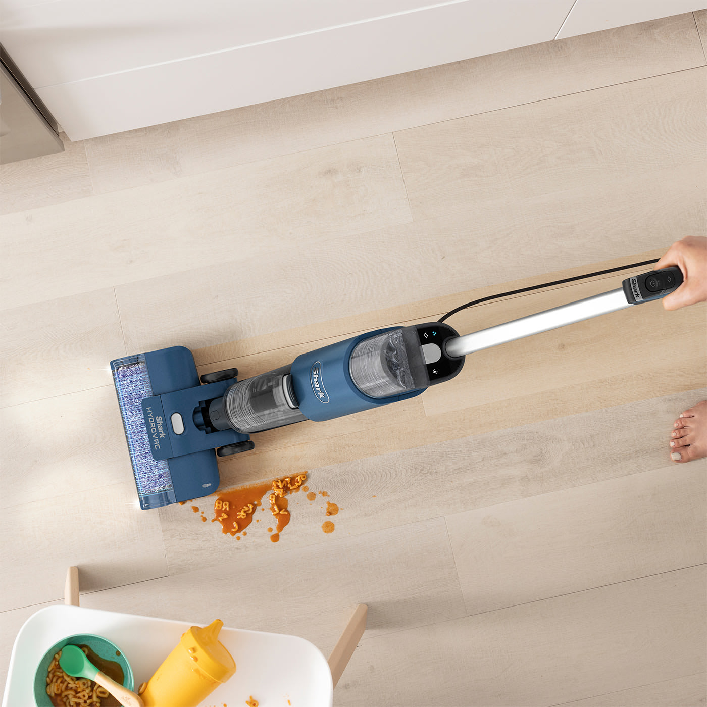 Vacuums, mops & cleans itself at the same time